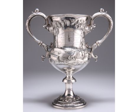 A LARGE VICTORIAN SILVER TROPHY CUP, by Martin, Hall & Co, Sheffield 1861, of baluster form with spreading foot and two folia