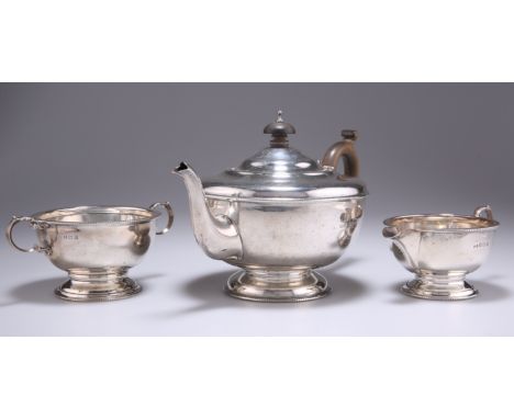 A GEORGE V SILVER THREE-PIECE TEA SERVICE,&nbsp;by&nbsp;Marson &amp; Jones, Birmingham 1931, comprising teapot, two-handled s