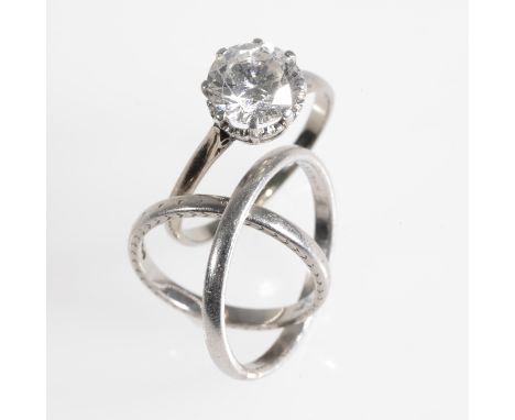 SOLITAIRE CLEAR STONE RING, on an unmarked white metal shank, ring size O, together with a palladium and platinum band (3)