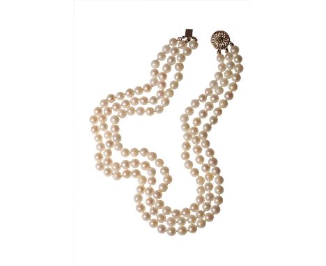 TRIPLE STRAND CULTURED PEARL NECKLACE, each pearl knotted, terminating onto a 14K yellow gold circular clasp, the longest str