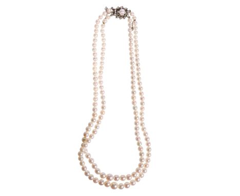 DOUBLE STRAND CULTURED PEARL NECKLACE, the unmarked white metal clasp set with white sapphires and a single cultured pearl, i