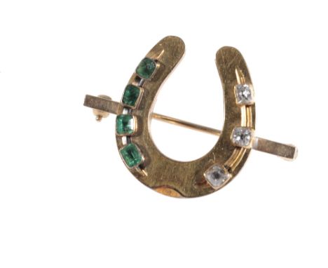 VICTORIAN HORSE SHOE BROOCH, DECORATED WITH DIAMONDS AND EMERALDS, the unmarked yellow metal horseshoe, with ring clip fasten