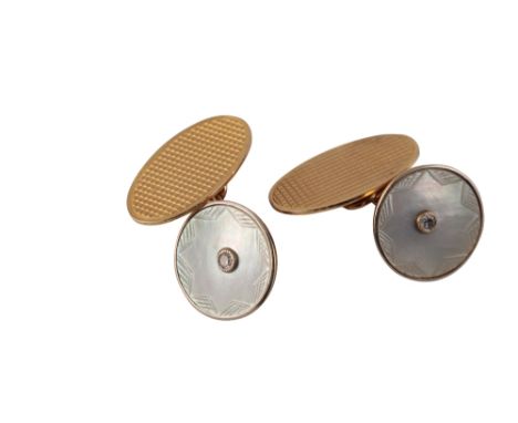 PAIR OF GENTLEMAN'S 9ct GOLD AND MOTHER OF PEARL CUFFLINKS, the circular mother of pearl set with a single diamond, chain con