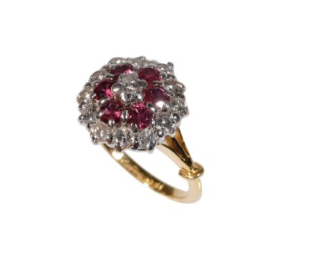 RUBY AND DIAMOND CLUSTER RING, the centre brilliant-cut diamond approximately 0.15ct, surrounded by a border of six rubies, a