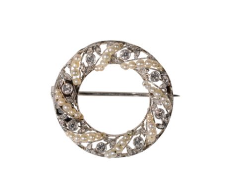 DIAMOND AND SEED PEARL CIRCULAR BROOCH, eight, collet set diamonds centred on micro diamond set leaves, between twisted rows 