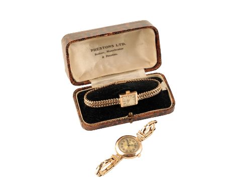 OMEGA 18CT GOLD LADY'S BRACELET WATCH with manual wind movement, the silver dial with gold baton numeral and hands, no. 10737