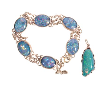 BLACK OPAL BRACELET, six opals collet-set with yellow gold backs, stamped "375", each opal with triple chain-link conections,