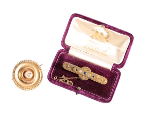 VICTORIAN ETRUSCAN REVIVAL BAR BROOCH, set with two diamonds and three "sapphires", with safety chain,stamped "625" in a fitt