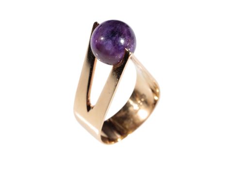 ARNE JOHANSEN DENMARK AMETHYST RING, the amethyst bead held between a raised triangular gold mount, on a yellow gold shank, s