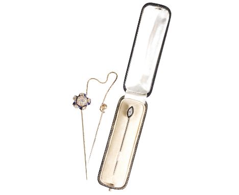 DIAMOND AND ENAMEL CRAVAT PIN, the old-cut diamond cluster, within a border of five further diamonds set on blue enamel scrol