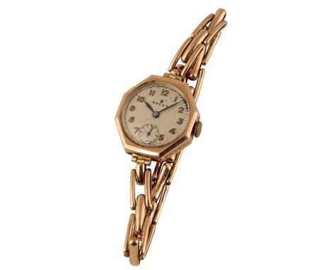 ROLEX 9CT GOLD LADY'S BRACELET WATCH, circa 1940's, with manual wind movement, the silver dial with gold Arabic numerals and 