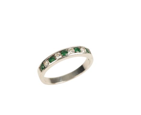 EMERALD AND DIAMOND HALF ETERNITY RING, on an 18ct white gold shank, ring size W