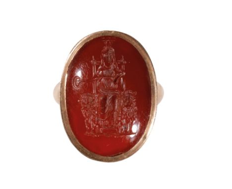 CARNELIAN INTAGLIO RING, the carved carnelian of an Asian maiden seated between two lions, enclosed back, on an unmarked yell