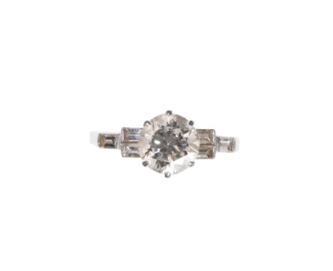 DIAMOND SOLITAIRE RING WITH DIAMOND BAGUETTE-CUT SHOULDERS, the brilliant-cut diamond approx 1.50ct, flanked either side with