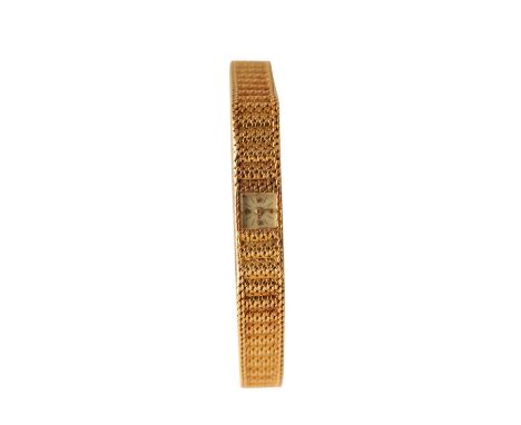 VACHERON CONSTANTIN 18 CT GOLD LADY'S BRACELET WATCH with manual wind movement, silver dial, gold baton numerals and hands, c