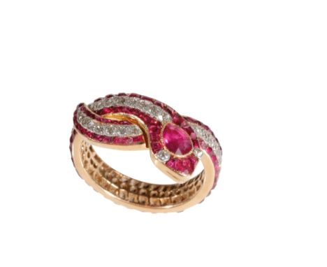 RUBY AND DIAMOND SNAKE RING, the collet-set ruby head, with diamond eyes, the body set with round-cut diamonds, flanked eithe