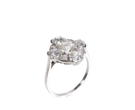 ART DECO DIAMOND CLUSTER RING, the centre diamond approx 0.85 carat, on an unmarked white metal shank, ring size O-P