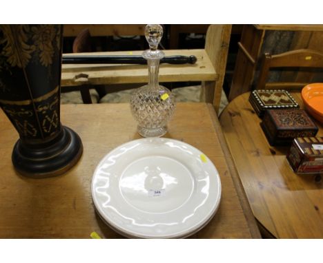 A Thomas Goode cut glass decanter and stopper and two white glazed plates