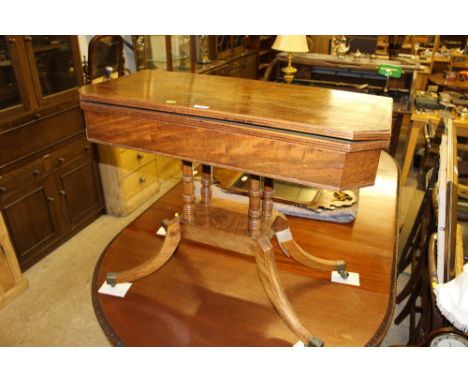 A 19th Century mahogany fold over card table