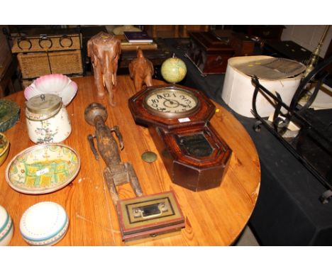 A faux rosewood cased drop dial wall clock; a small tin world globe; two carved hardwood elephant ornaments etc.