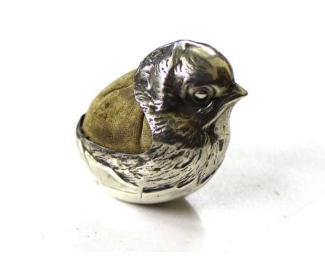 A Samson and Morden silver novelty pin cushion in the form of a chick; a 19th Century silver snuff box/cheroot cutter etc.