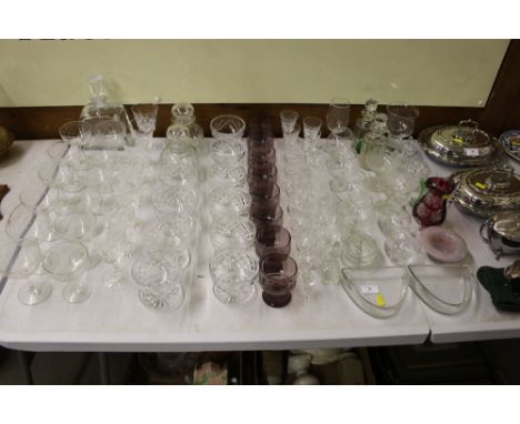 A quantity of various drinking glasses; an etched glass decanter and stopper etc.
