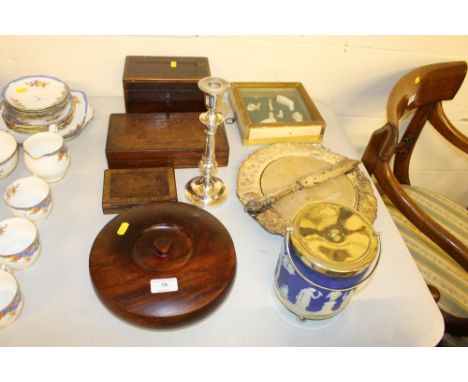 A Wedgwood Jasperware biscuit barrel; a silver plate mounted bread board; a candlestick; a 19th Century mahogany tea caddy et