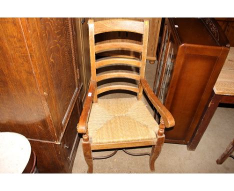 A set of six Continental style ladder back and rush seated dining chairs to include two carvers