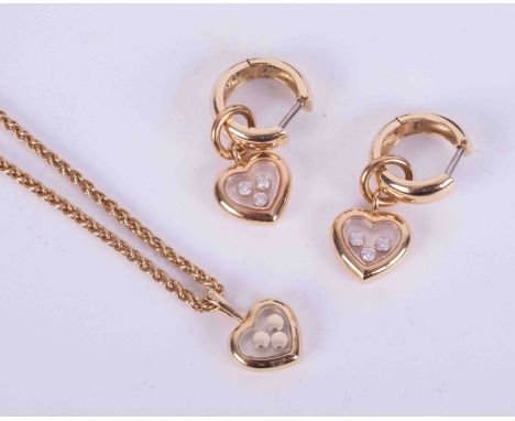 A jewellery suite by Chopard 'Happy Diamonds' to include a pair of 18ct yellow gold heart drop earrings with 6 round brillian