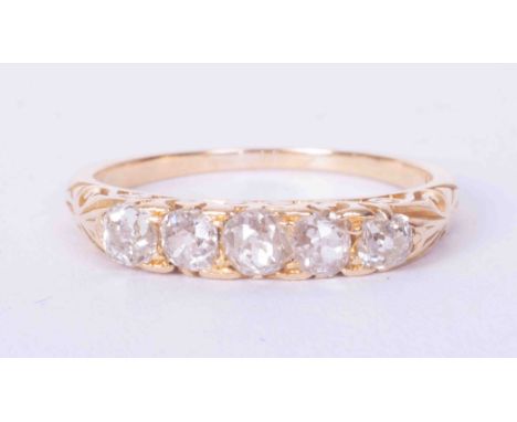 An antique 18ct yellow gold scroll design ring set five old cut diamonds, approx total weight 0.80 carats, colour G to H and 