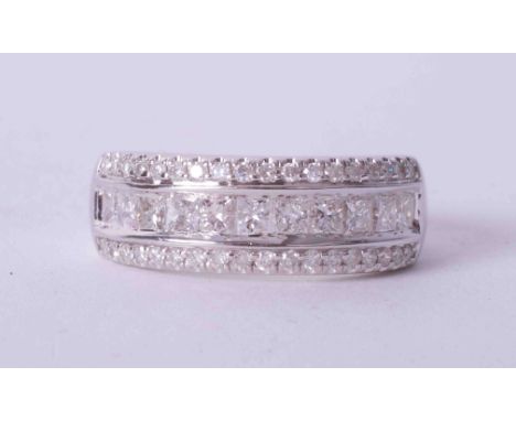 An 18ct white gold three row half eternity style ring set with 1.00 carats of princess cut &amp; round brilliant cut diamonds