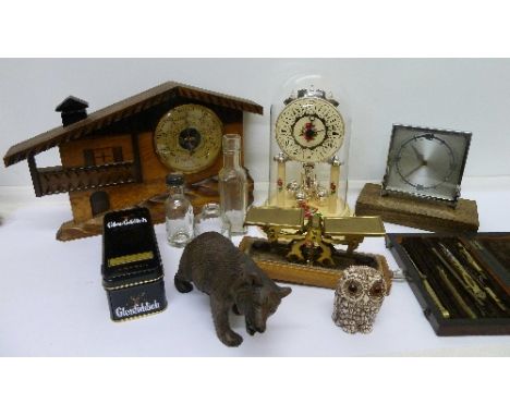 An anniversary clock, one other clock, a barometer, a black forest bear, scales, etc.