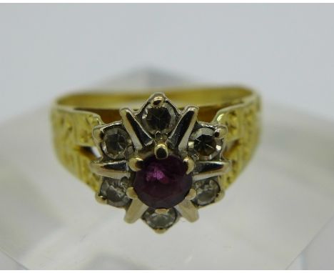 An 18ct gold, diamond and purple stone cluster ring, weight 3.3g, size K