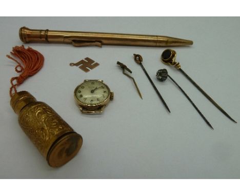 A lady's 9ct gold wristwatch head, stick pins, a rolled gold pen, etc.