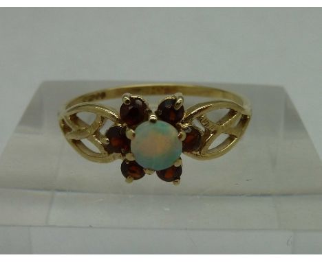 A 9ct gold, opal and garnet ring, weight 1.6g, size P