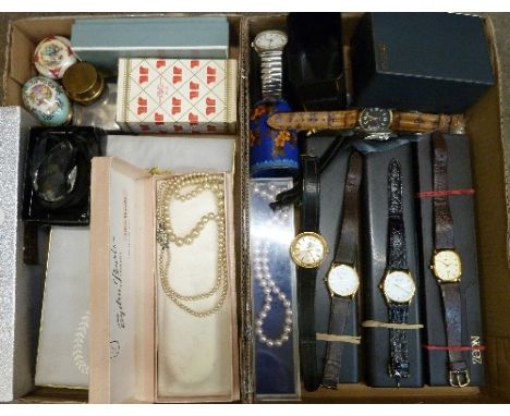 Wrist watches, a Coronation cake knife, trinket boxes, Avon perfume, etc.