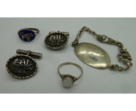 A silver bracelet, a pair of silver cufflinks and two silver rings