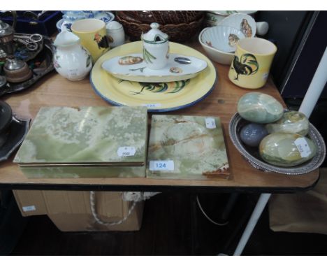 A selection of onyx style carved eggs and trinket box