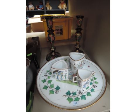 A hand decorated part tea service with tray decorated in a Kate Greenaway style and decorated candle sticks