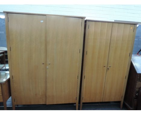 A vintage G plan 4 piece bedroom suite comprising two wardrobes, dressing table and chest of drawers