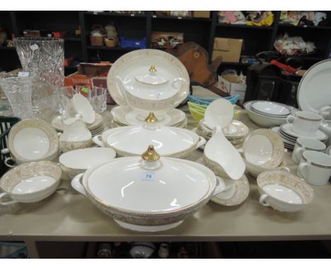 A Royal Doulton tea and dinner service in the gold heightened floral Sovereign pattern, H4972