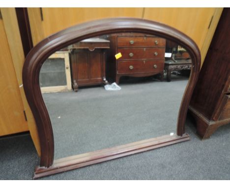 A reproduction mahogany effect over mantel mirror99CM X 74CM