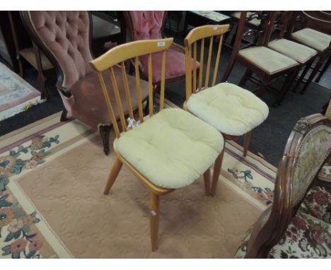 A pair of Erccol style stick back kitchen chairs