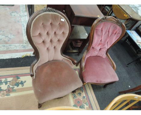 Two Victorian style button back chairs in pink dralon