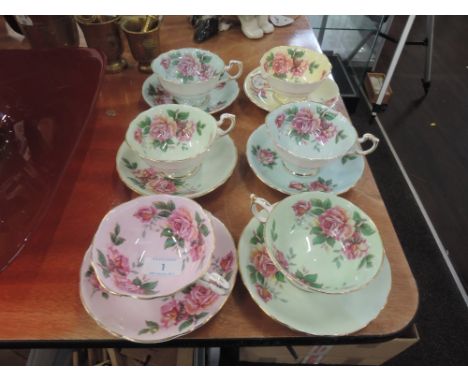 A set of six harlequin tea cups and saucers by Paragon