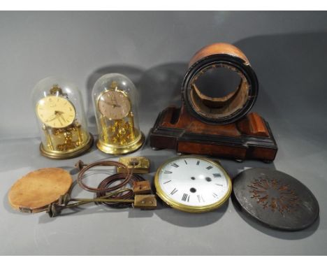 Two anniversary clocks, the first a Kundo example the other a Bentima and a quantity of clock parts.