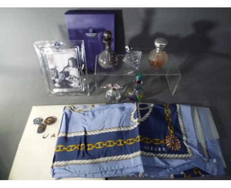 A lot to include a quantity of glass perfume bottles, cut glass Edinburgh crystal photograph frame, silk Jaeger scarf, sterli