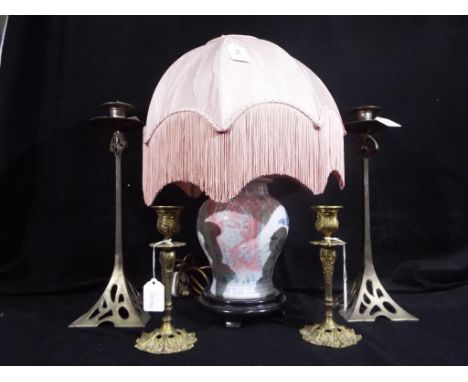 Two pairs of candlesticks and a decorative Oriental table lamp with shade, the largest candlestick measures approximately 37 