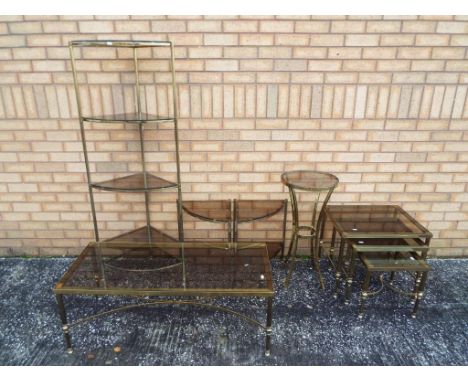 A quantity of glass and brass matching furniture to include nest of tables, coffee table, lamp tables and similar