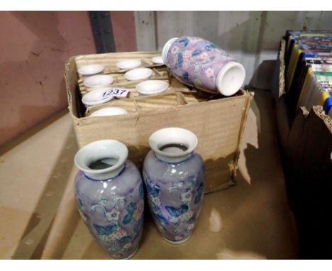 Twelve glazed ceramic bud vases. Not available for in-house P&amp;P 
